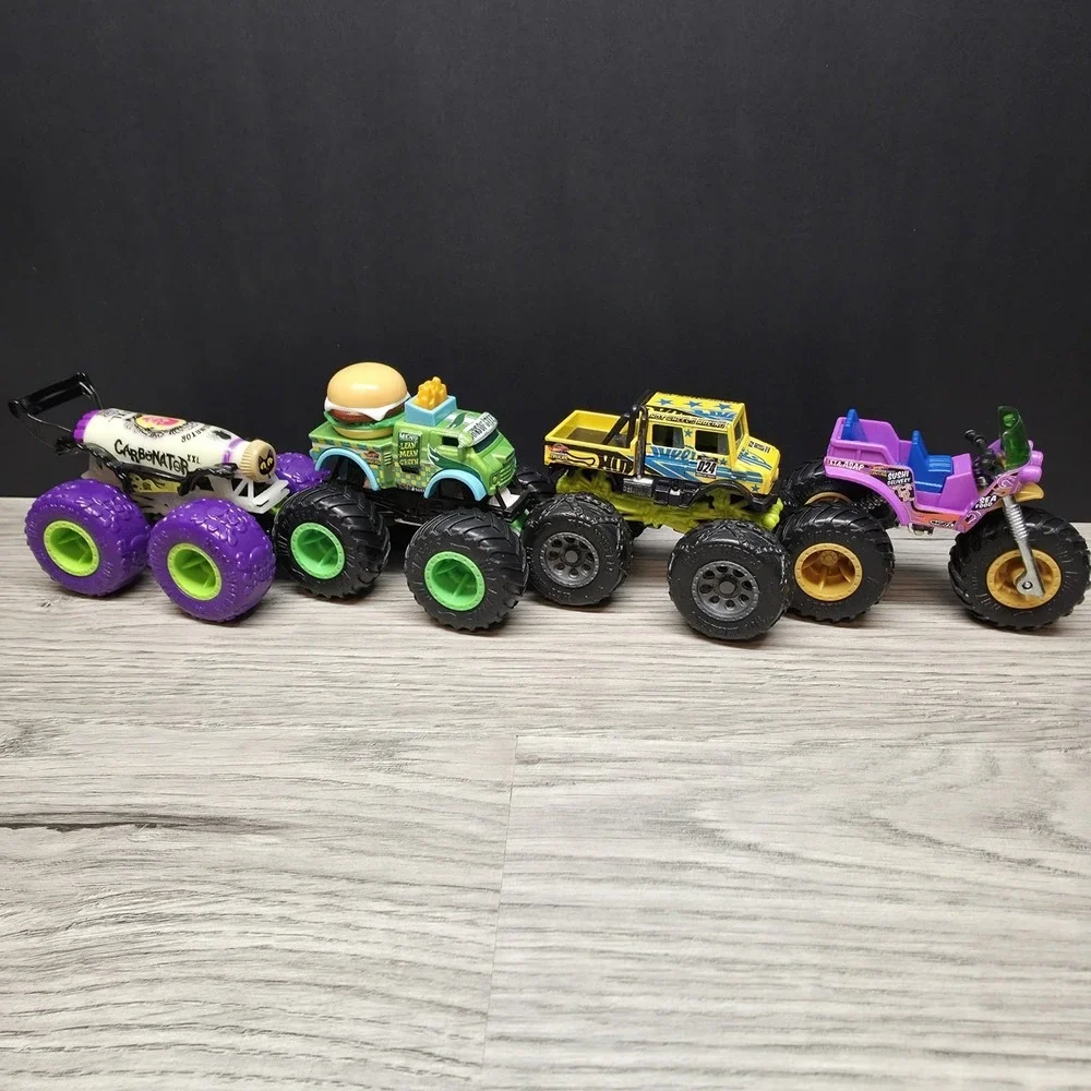 Hotwheels Monster Trucks Lot - Carbonator, Buns Of Steel, Unimog, And Tuk N Roll